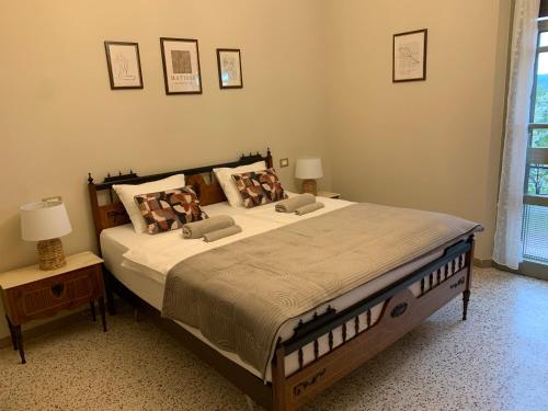a bedroom with a large bed with two pillows at il nuvoloso in Città della Pieve