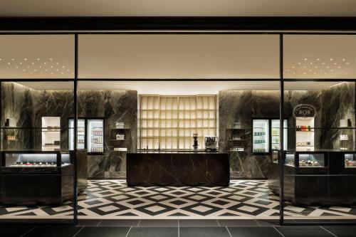 a store with glass walls and a checkered floor at The Westin Tokyo in Tokyo