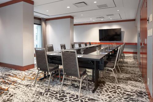 a conference room with a long table and chairs at Delta Hotels by Marriott Vancouver Downtown Suites in Vancouver