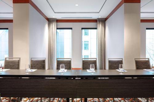a room with a table with wine glasses on it at Delta Hotels by Marriott Vancouver Downtown Suites in Vancouver