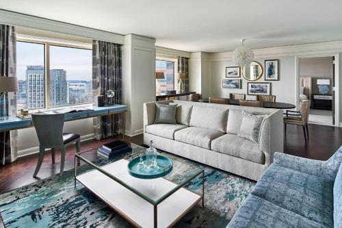 a living room with a couch and a table at The Ritz-Carlton, Tysons Corner in Tysons Corner