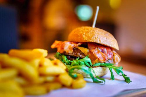 a sandwich on a bun with a toothpick in it at Mühle Tornow am Wentowsee in Tornow
