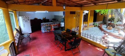 a room with a table and chairs in a house at Villa Margarita in Puerto Colombia