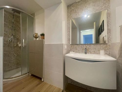 a bathroom with a sink and a shower at CAIROLI14 in Brescia
