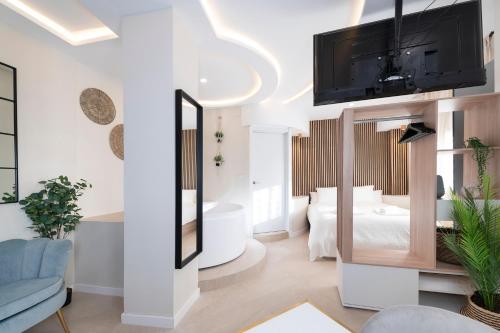 Giường trong phòng chung tại MALAGA BOUTIQUE V.V LUXURY JACUZZY