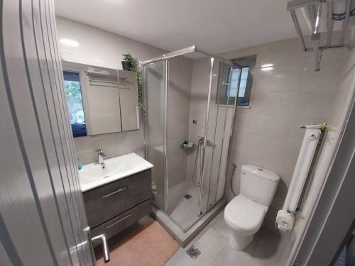 a bathroom with a shower and a toilet and a sink at Fairytale στις Αλυκές Χαλκίδας in Chalkida