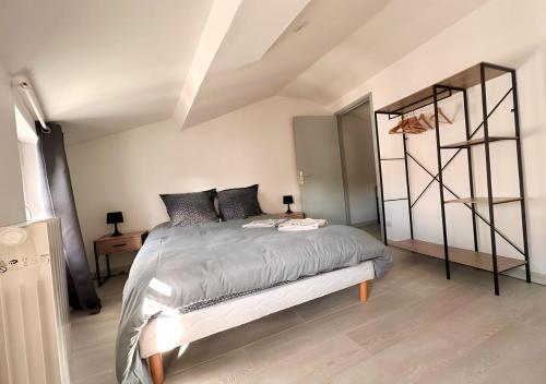 a bedroom with a large bed in a room at CASA TULUM in Cognac