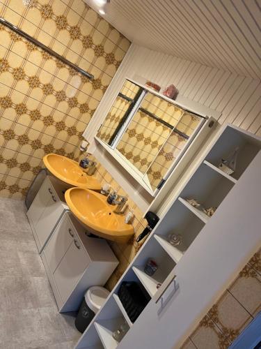 a bathroom with a sink and a toilet at Beti Apartment in Nentershausen