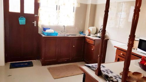a kitchen with a sink and a window at Jetpoint- Central Nadi 2 bedrm in Nadi