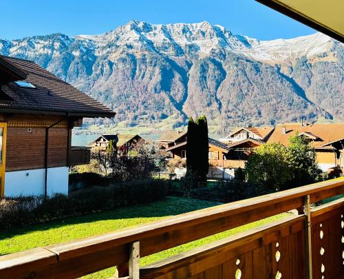 a view of a mountain from a house at Chalet Swiss Alpine Haven in Iseltwald