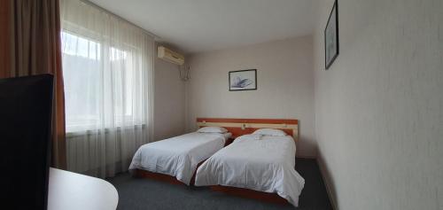 Ένα ή περισσότερα κρεβάτια σε δωμάτιο στο Motel Monza