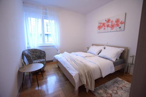 Postel nebo postele na pokoji v ubytování Apartman Gajeva