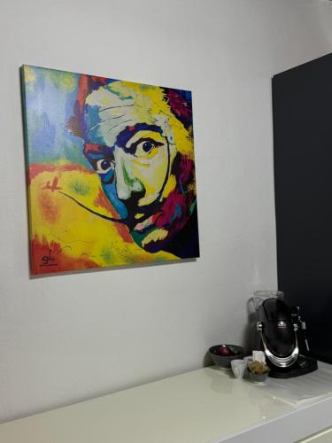 a painting of a woman hanging on a wall at Il Pentolo in Sansepolcro