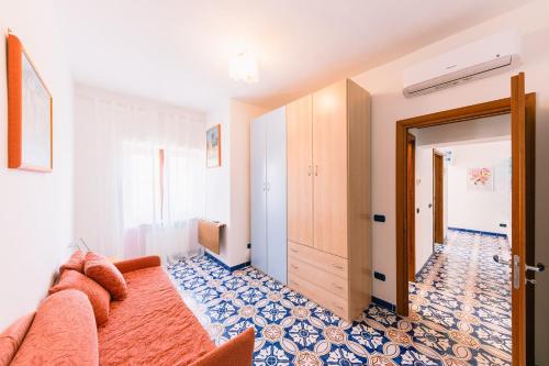 a room with a bed and a hallway with a door at Casa Vacanze La Trinità in Ravello