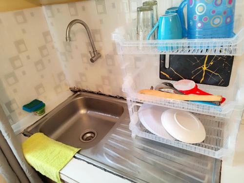 a kitchen with a sink and a sink at The Little Haven - Ample Parking, Views & Netflix in Kikuyu