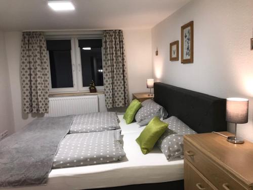 Postel nebo postele na pokoji v ubytování Gästehaus Reimold