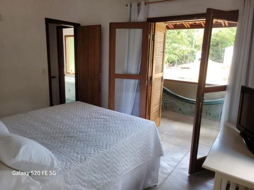 En eller flere senge i et værelse på Casa Martins