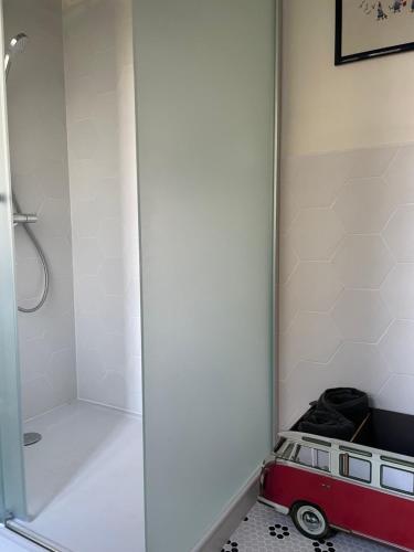 a bathroom with a shower with a toy van in it at Chateau de Vaugelas - Charmant domaine près de Valence in Alixan
