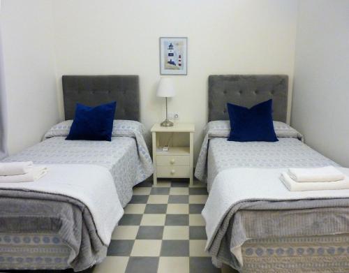 En eller flere senge i et værelse på APARTAMENTO APODACA