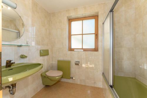 a bathroom with a sink and a toilet and a shower at Haus Diamant by Schladming-Appartements in Schladming