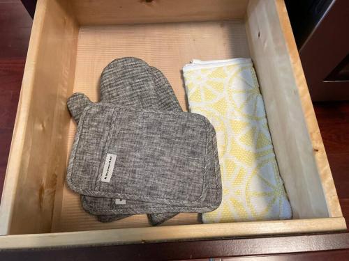 a box with two mittens and a pillow at Gorgeous Williamsville Home in Central Location in Buffalo