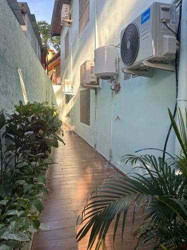an alley with a building with an air conditioner at Noor Residence in Pamandzi