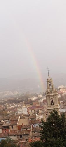 a view of a city with a clock tower at El Mirador"Venerable Escuder" in Cocentaina