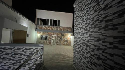 a room with a brick wall and a building at kaizen Restaurant Nouakchott in Nouakchott