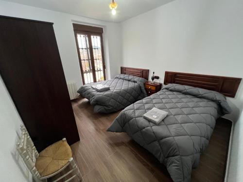 A bed or beds in a room at Casa rural El Molino 2