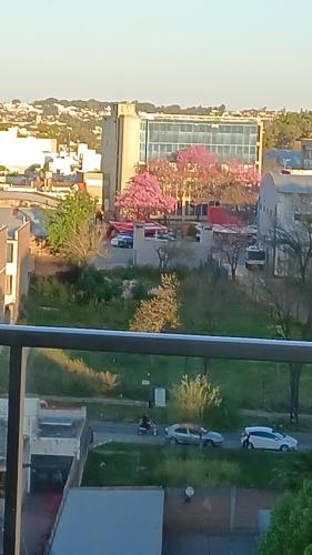 a view of a parking lot with cars and buildings at MONOAMBIENTE - Parana TU CASA in Paraná