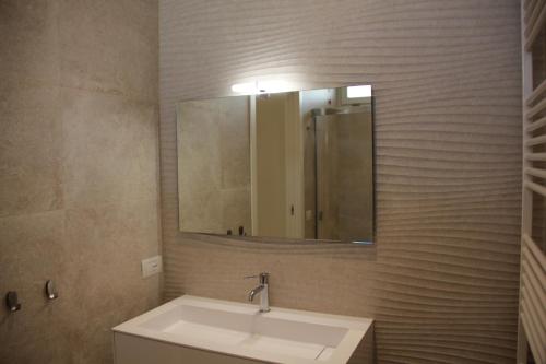 a bathroom with a sink and a mirror at Mari'Entu in Quartu SantʼElena