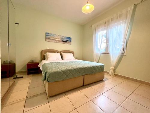 Postel nebo postele na pokoji v ubytování Villa Platanias