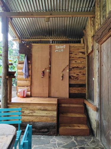 a wooden structure with a toilet in a room at Eco-Hotel Mayachik in San Juan La Laguna