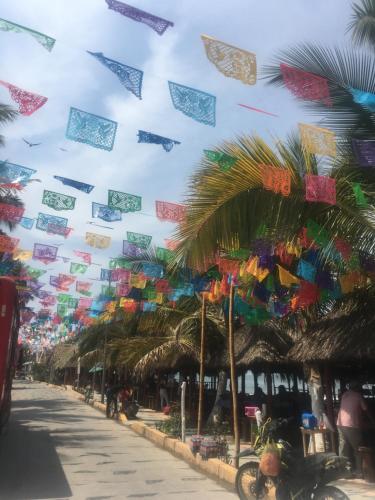 a street with many kites flying in the sky at Casa Karina, Spectacular Ocean View Pool Oasis in Aticama