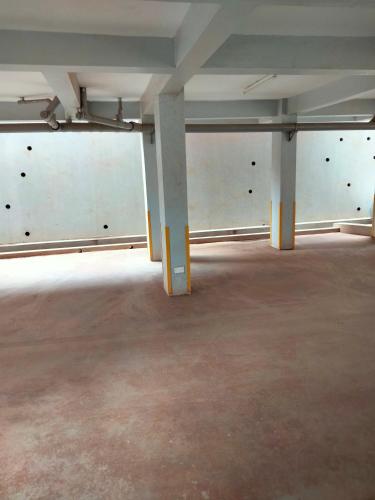 an empty room with white walls and concrete floors at The Little Haven - Ample Parking, Views & Netflix in Kikuyu