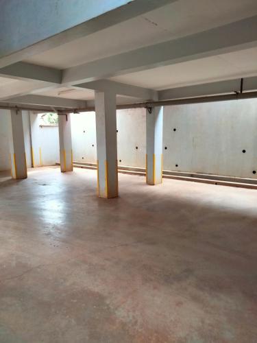 an empty room with white pillars in a building at The Little Haven - Ample Parking, Views & Netflix in Kikuyu