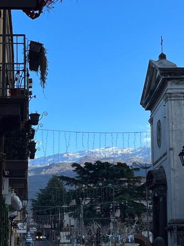 a view of a city with a clock tower at Dimora dell'Etna in Randazzo