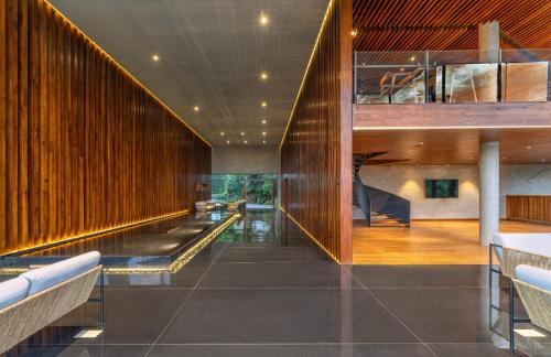 a lobby of a building with wooden walls at The Trees, Kandy in Kandy