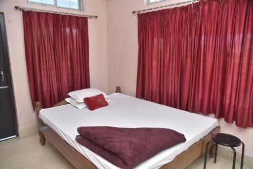 Krevet ili kreveti u jedinici u objektu Bibhas Lodge & Restaurant
