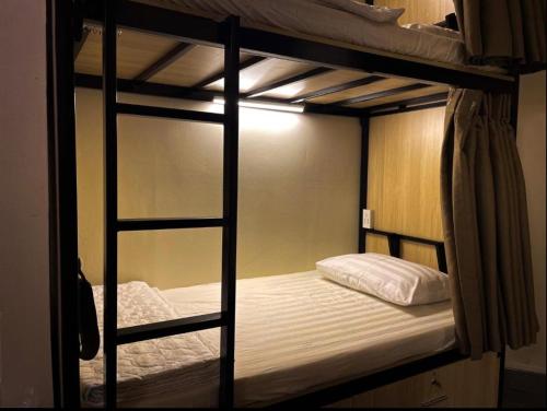 a couple of bunk beds in a room at 4K Hostel in Ho Chi Minh City