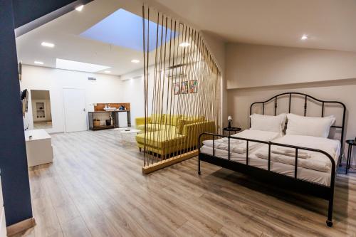 a bedroom with a bed and a living room at B2 Delux Studio Saffron in Plovdiv