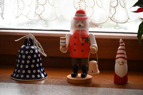 a figurine of a santa on a shelf with other items at Strażnica Pod Lasem in Lasowka