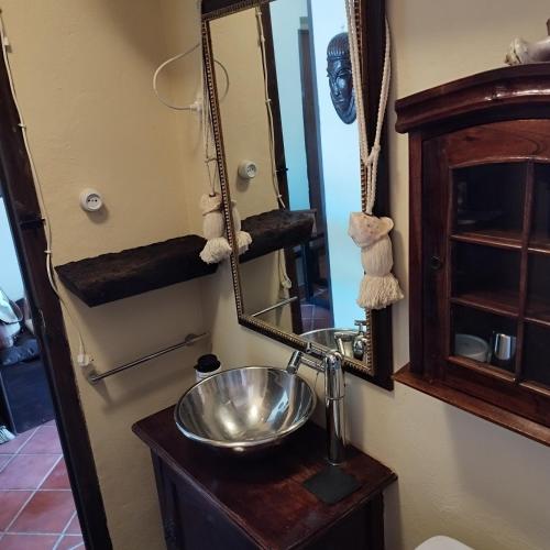 a bathroom with a sink and a mirror at Sierra Nevada Alcazaba in Sierra Nevada