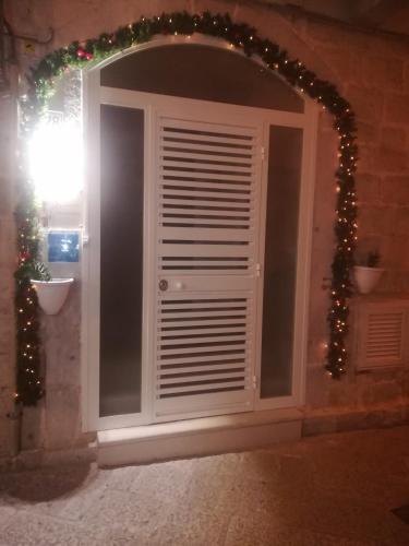 an archway with christmas lights in a room at Casa Vacanza Al Duomo in Barletta