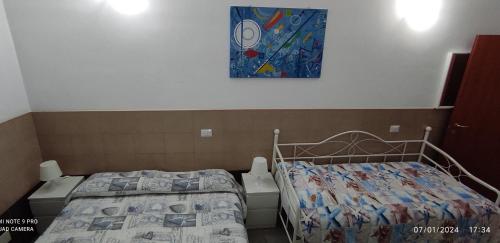 Postel nebo postele na pokoji v ubytování Coccinella