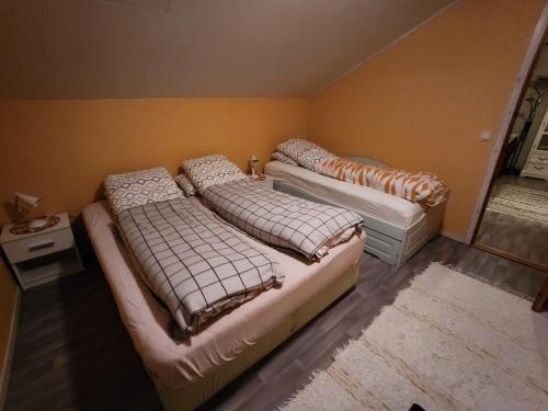 Postel nebo postele na pokoji v ubytování Tromtind Lodge