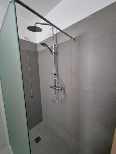 a shower in a bathroom with a glass door at CityHotel Cristina Vicenza in Vicenza