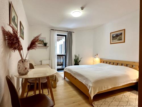 A bed or beds in a room at Apartment Harmony - Tatranska Lomnica, Javorinka