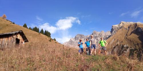 a group of people walking up a hill at Arlberghaus Rocks in Flirsch