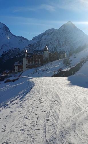 a ski slope with tracks in the snow in front of a mountain at T3 Les deux Alpes Vallée Blanche in Les Deux Alpes